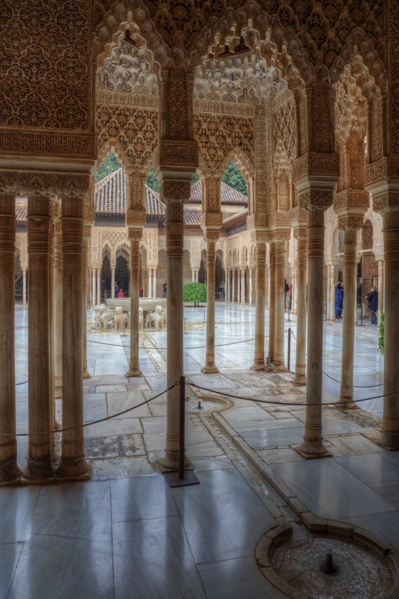 The intricate columns and arches of Alhambra Palace offer a glimpse into its Moorish architectural beauty.